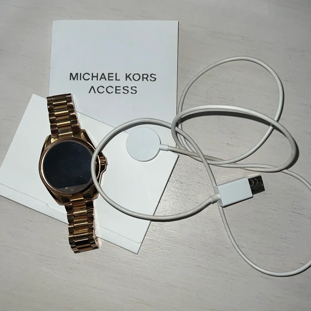 Michael kors smart watch with charger and paperwork